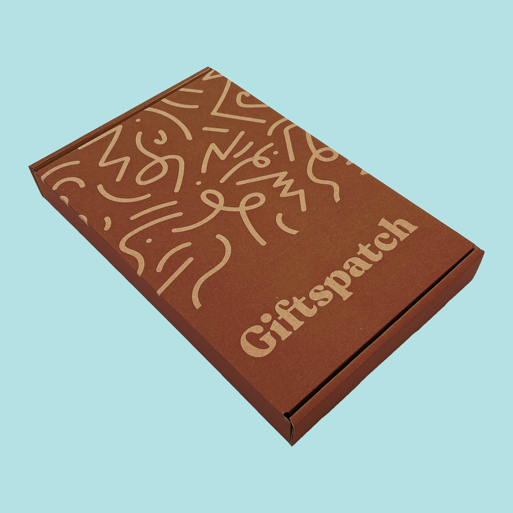 Active Box closed, showing the brown Giftspatch letterbox mailer with its cream squiggle print